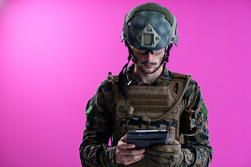 Image showing soldier using tablet computer closeup