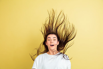 Image showing Easter bunny woman with bright emotions on yellow studio background