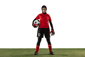 Image showing Arabian female soccer or football player, goalkeeper on white studio background