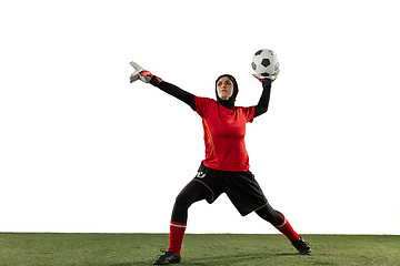 Image showing Arabian female soccer or football player, goalkeeper on white studio background