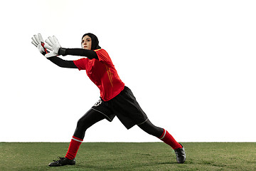 Image showing Arabian female soccer or football player, goalkeeper on white studio background