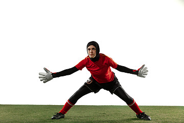 Image showing Arabian female soccer or football player, goalkeeper on white studio background