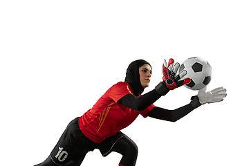 Image showing Arabian female soccer or football player, goalkeeper on white studio background