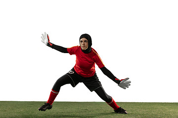 Image showing Arabian female soccer or football player, goalkeeper on white studio background