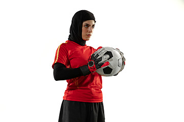 Image showing Arabian female soccer or football player, goalkeeper on white studio background