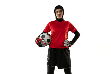 Image showing Arabian female soccer or football player, goalkeeper on white studio background