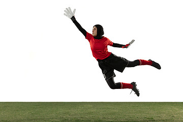 Image showing Arabian female soccer or football player, goalkeeper on white studio background