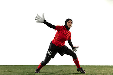 Image showing Arabian female soccer or football player, goalkeeper on white studio background