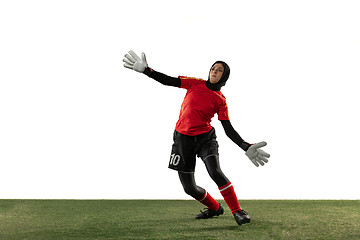 Image showing Arabian female soccer or football player, goalkeeper on white studio background