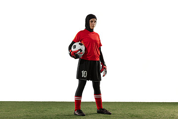 Image showing Arabian female soccer or football player, goalkeeper on white studio background