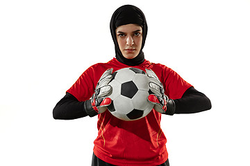 Image showing Arabian female soccer or football player, goalkeeper on white studio background