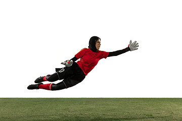 Image showing Arabian female soccer or football player, goalkeeper on white studio background