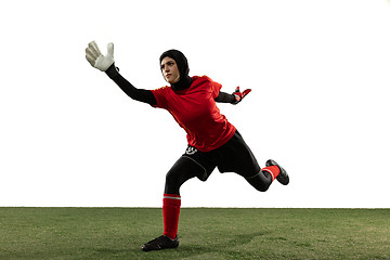 Image showing Arabian female soccer or football player, goalkeeper on white studio background