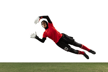 Image showing Arabian female soccer or football player, goalkeeper on white studio background