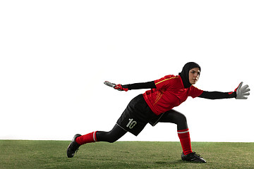 Image showing Arabian female soccer or football player, goalkeeper on white studio background