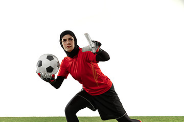 Image showing Arabian female soccer or football player, goalkeeper on white studio background