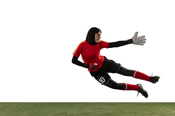 Image showing Arabian female soccer or football player, goalkeeper on white studio background