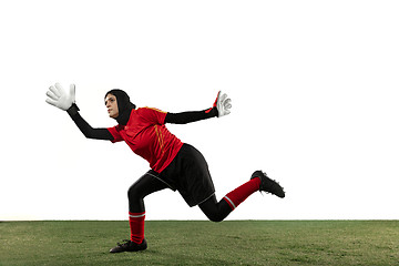 Image showing Arabian female soccer or football player, goalkeeper on white studio background