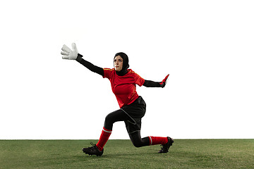 Image showing Arabian female soccer or football player, goalkeeper on white studio background