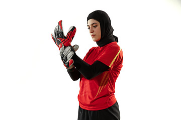 Image showing Arabian female soccer or football player, goalkeeper on white studio background