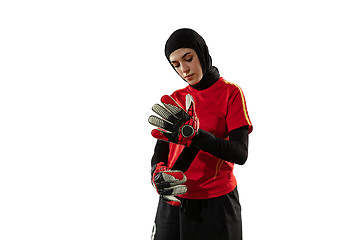 Image showing Arabian female soccer or football player, goalkeeper on white studio background