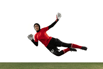 Image showing Arabian female soccer or football player, goalkeeper on white studio background