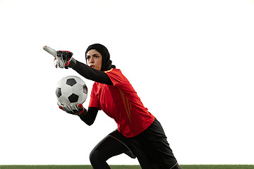 Image showing Arabian female soccer or football player, goalkeeper on white studio background