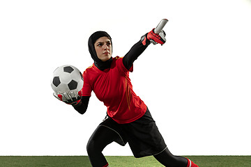 Image showing Arabian female soccer or football player, goalkeeper on white studio background