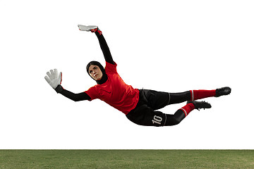 Image showing Arabian female soccer or football player, goalkeeper on white studio background