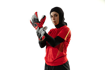 Image showing Arabian female soccer or football player, goalkeeper on white studio background