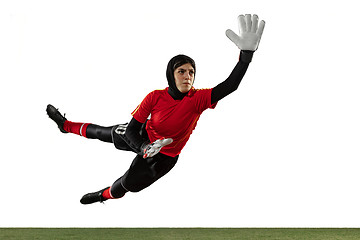 Image showing Arabian female soccer or football player, goalkeeper on white studio background