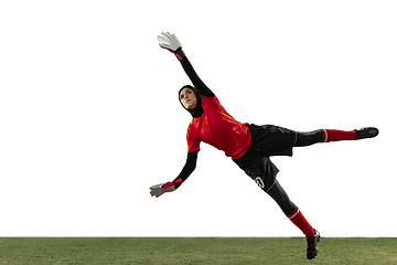 Image showing Arabian female soccer or football player, goalkeeper on white studio background