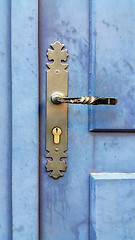 Image showing Vintage wooden blue door with metallic handle and keyhole