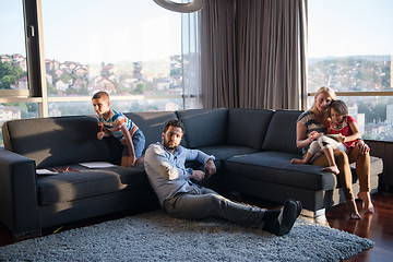 Image showing Happy Young Family Playing Together on sofa