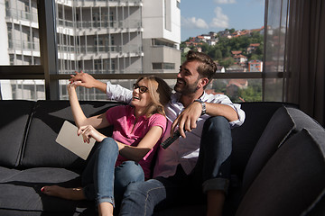 Image showing Young couple watching television