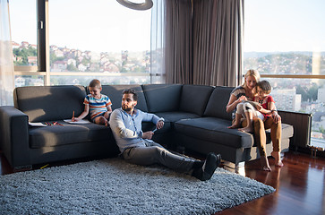 Image showing Happy Young Family Playing Together on sofa