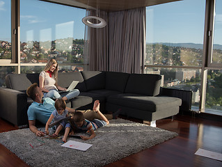 Image showing young couple spending time with kids at home