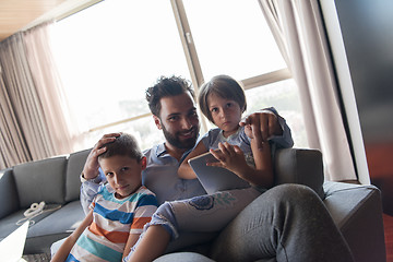 Image showing happy young father spending time with kids