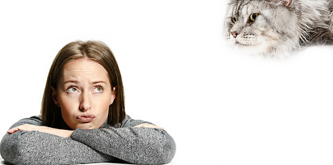 Image showing Woman with her cat over white background