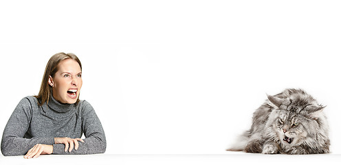 Image showing Woman with her cat over white background