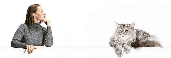 Image showing Woman with her cat over white background