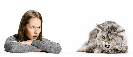 Image showing Woman with her cat over white background