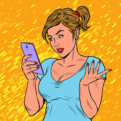 Image showing A young woman with a smartphone. Techniques and gadgets