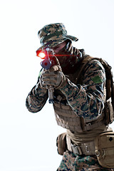 Image showing soldier in action aiming laseer sight optics