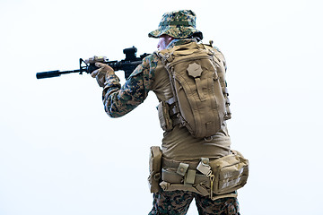 Image showing soldier in action aiming laseer sight optics