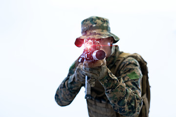 Image showing soldier in action aiming laseer sight optics