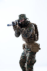 Image showing soldier in action aiming laseer sight optics