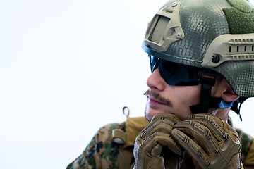 Image showing soldier preparing gear for action