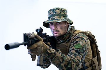 Image showing soldier in action aiming laseer sight optics