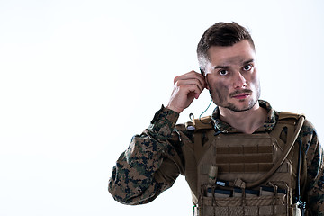 Image showing soldier preparing gear for action